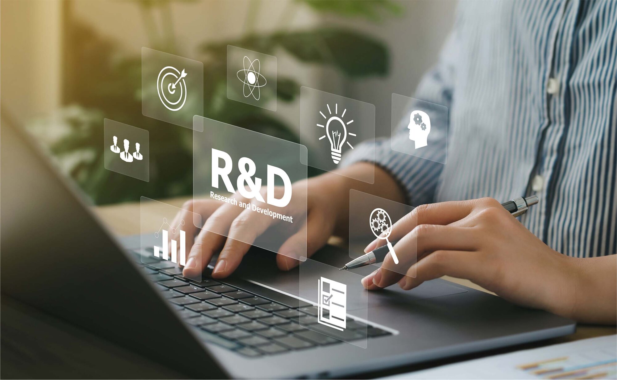 An image displaying all the factors needed for research and development above a keyboard.