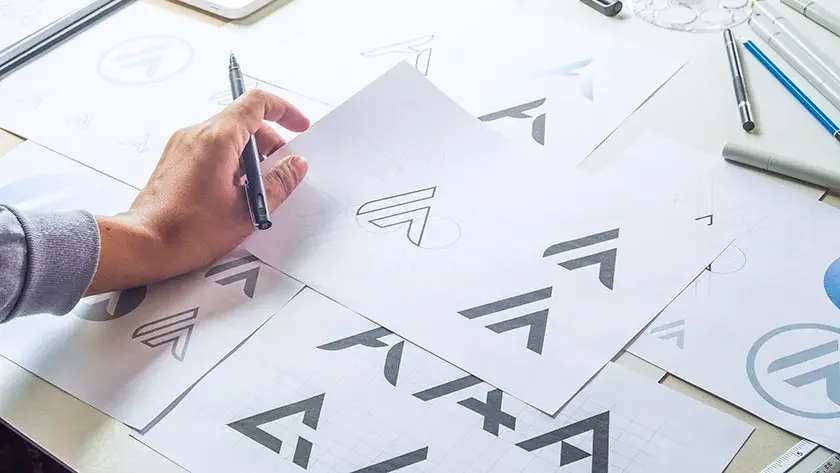 A graphic designer creates a logo she hopes to trademark.