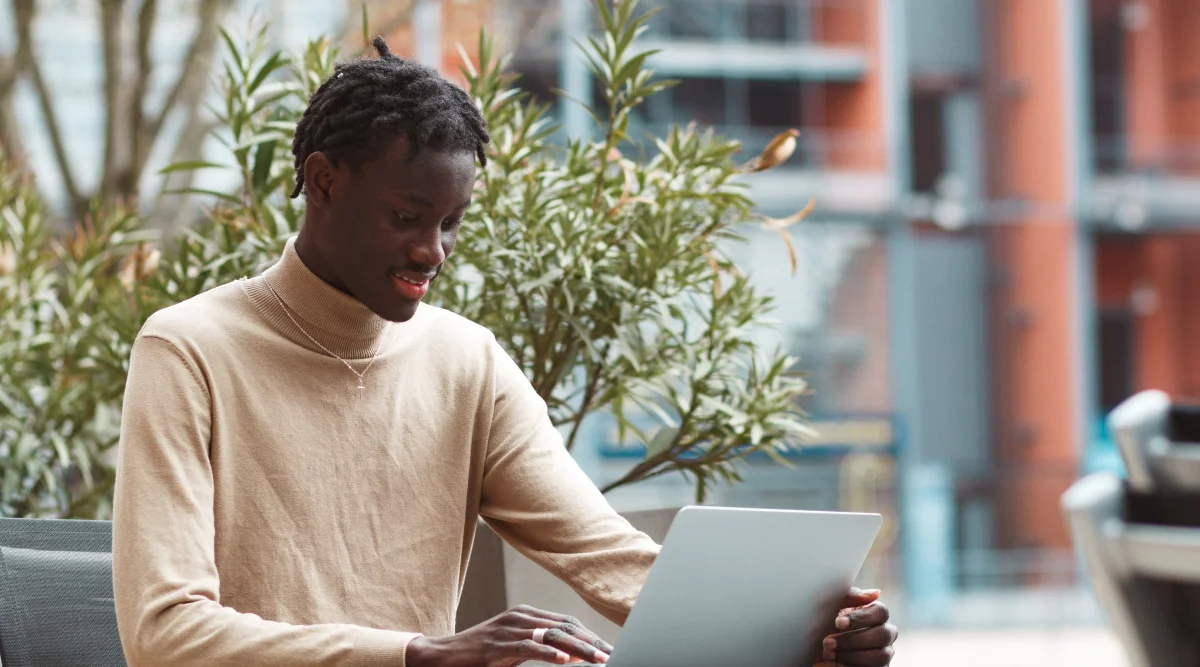 A man working on a laptop.