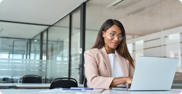 A woman working at a desk.