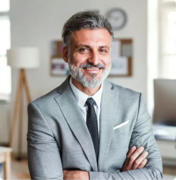 A male family law attorney wearing a gray suit who specializes in legal name change