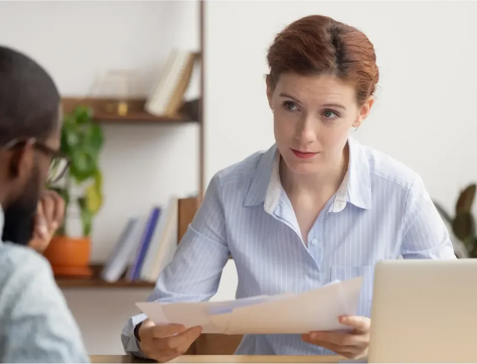 A woman considering bankruptcy goes over different kinds of exemptions with her attorney.