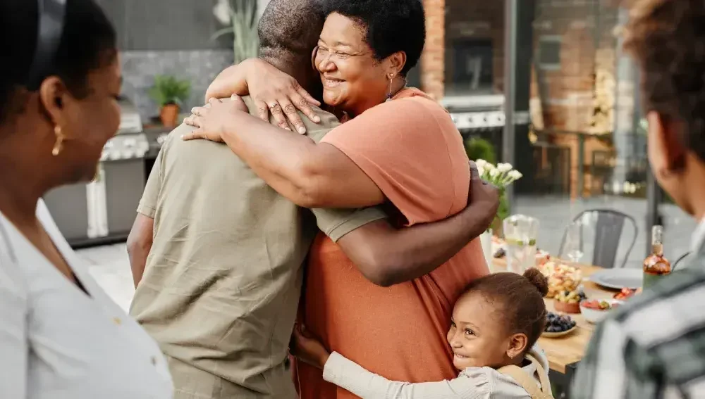 A woman giving a man a hug after setting up LegalZoom living trust.