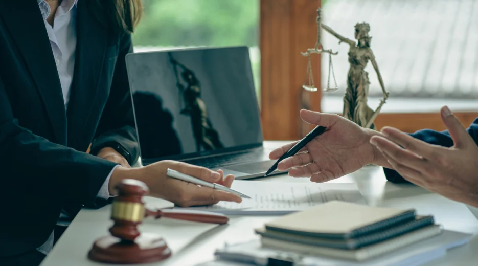 A lawyer meets with a judge in her office