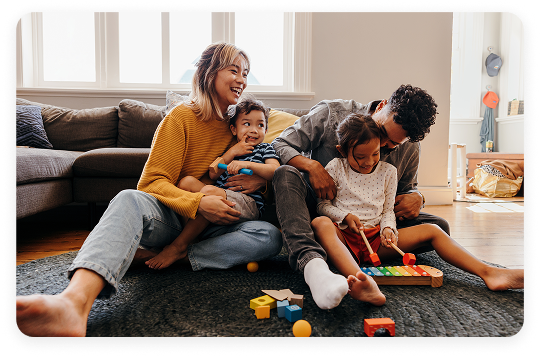 A joyful husband and wife celebrating after successfully creating their family estate planning documents, including a trust, to secure their children's future.