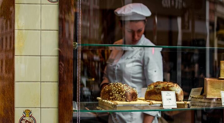 A woman works in a bakery