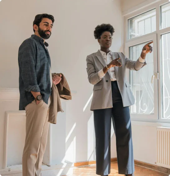 A man and women tour commercial real estate 