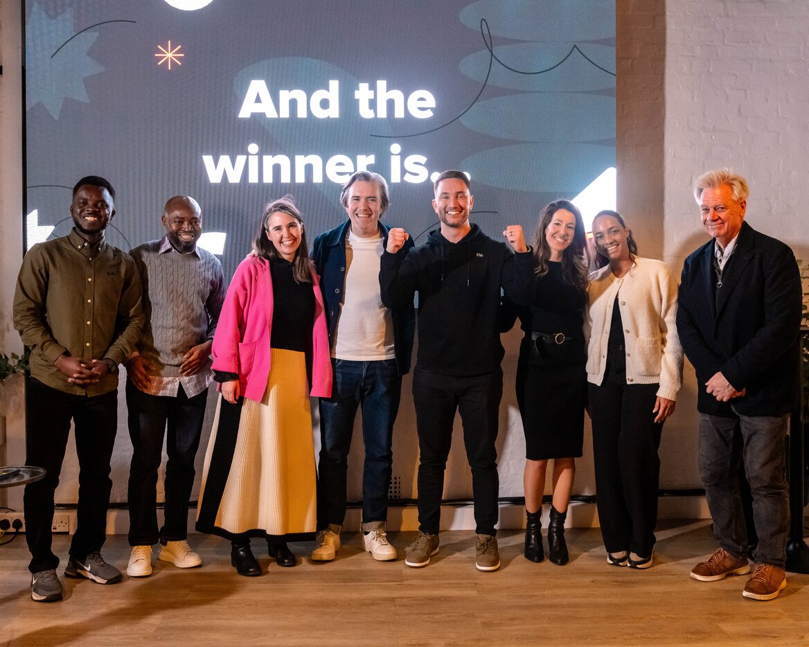 Pie team celebrating their win at StartUp Grind UK to Global event on stage