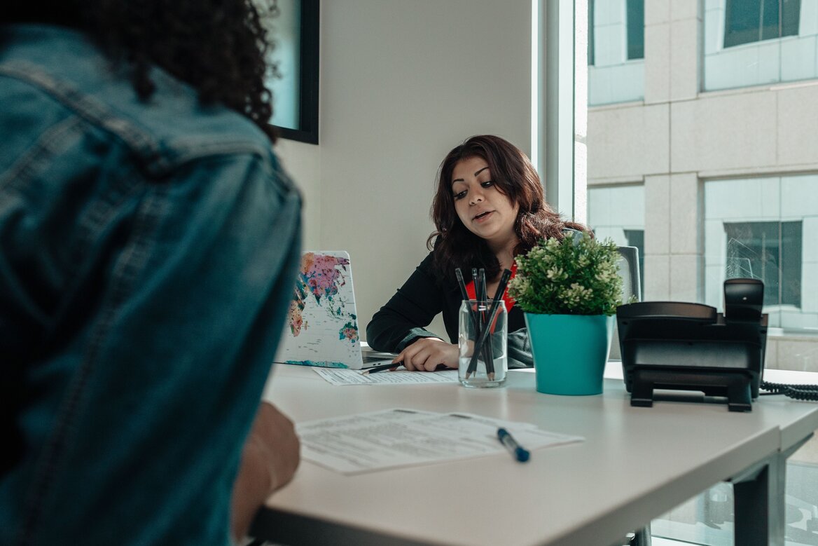 Accountant discussing tax documents with a client during a self assessment consultation