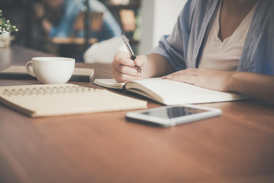 lady writing on a piece of paper