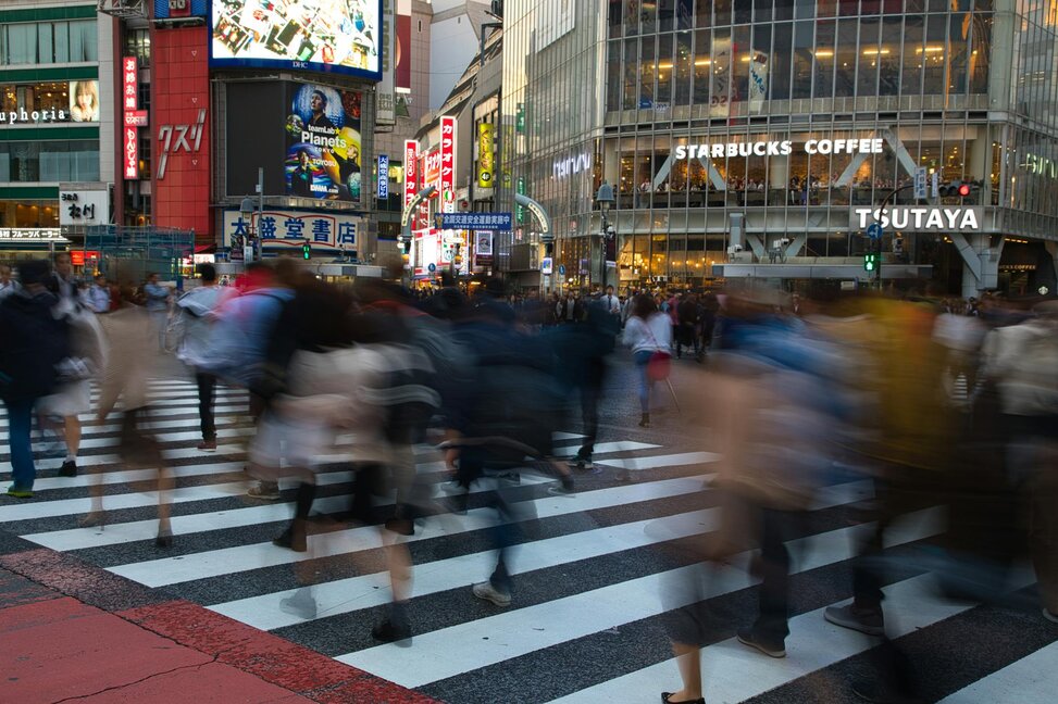 people walking across the street 