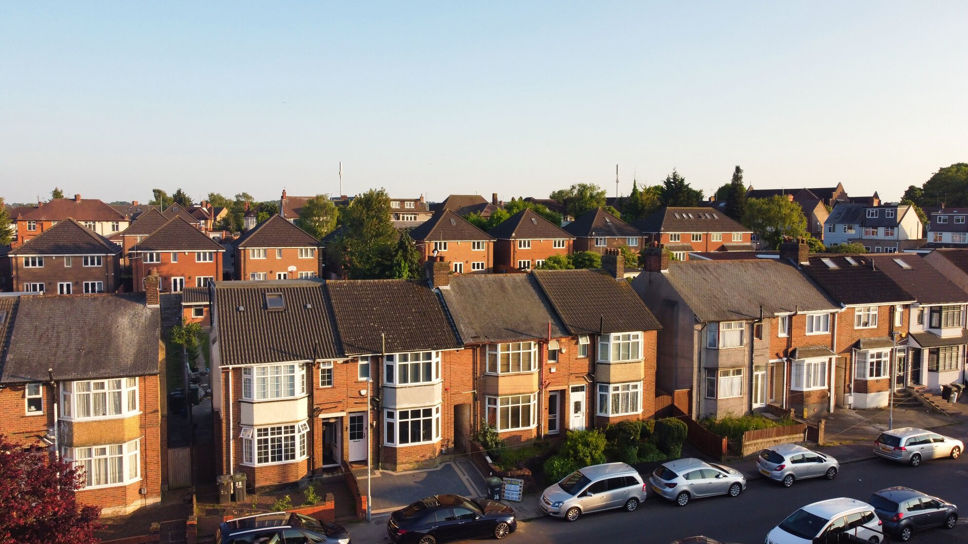 Aerial view of a UK residential street with terraced and semi-detached rental properties