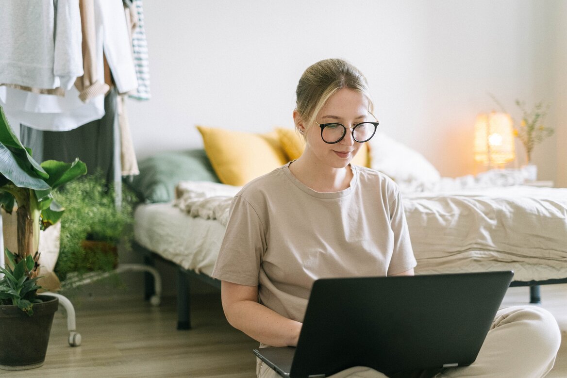 Woman checking her Self Assessment status on a laptop at home