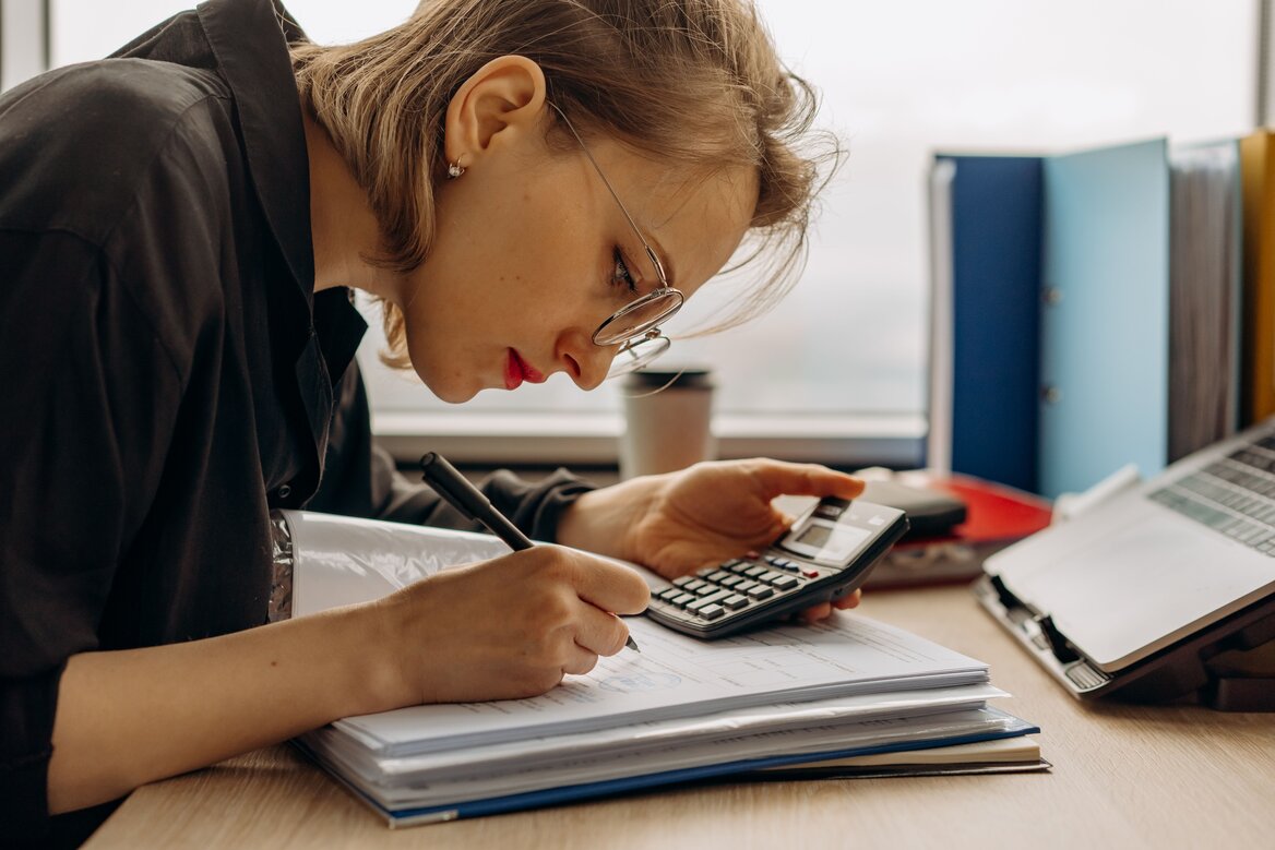 Handwritten notes listing income, business, and tax categories for bookkeeping records