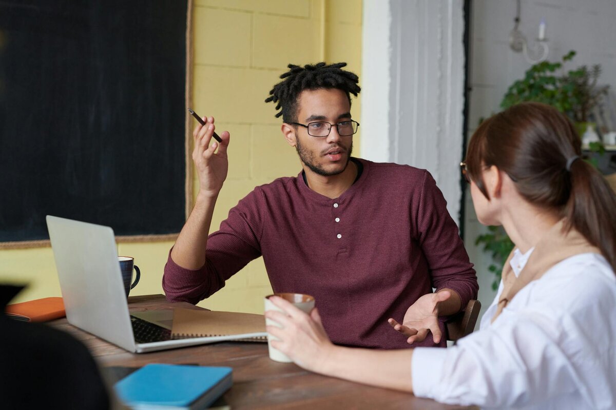 man explaining to a woman 