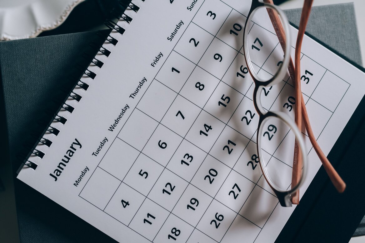 Calendar with  glasses to represent shifting deadlines