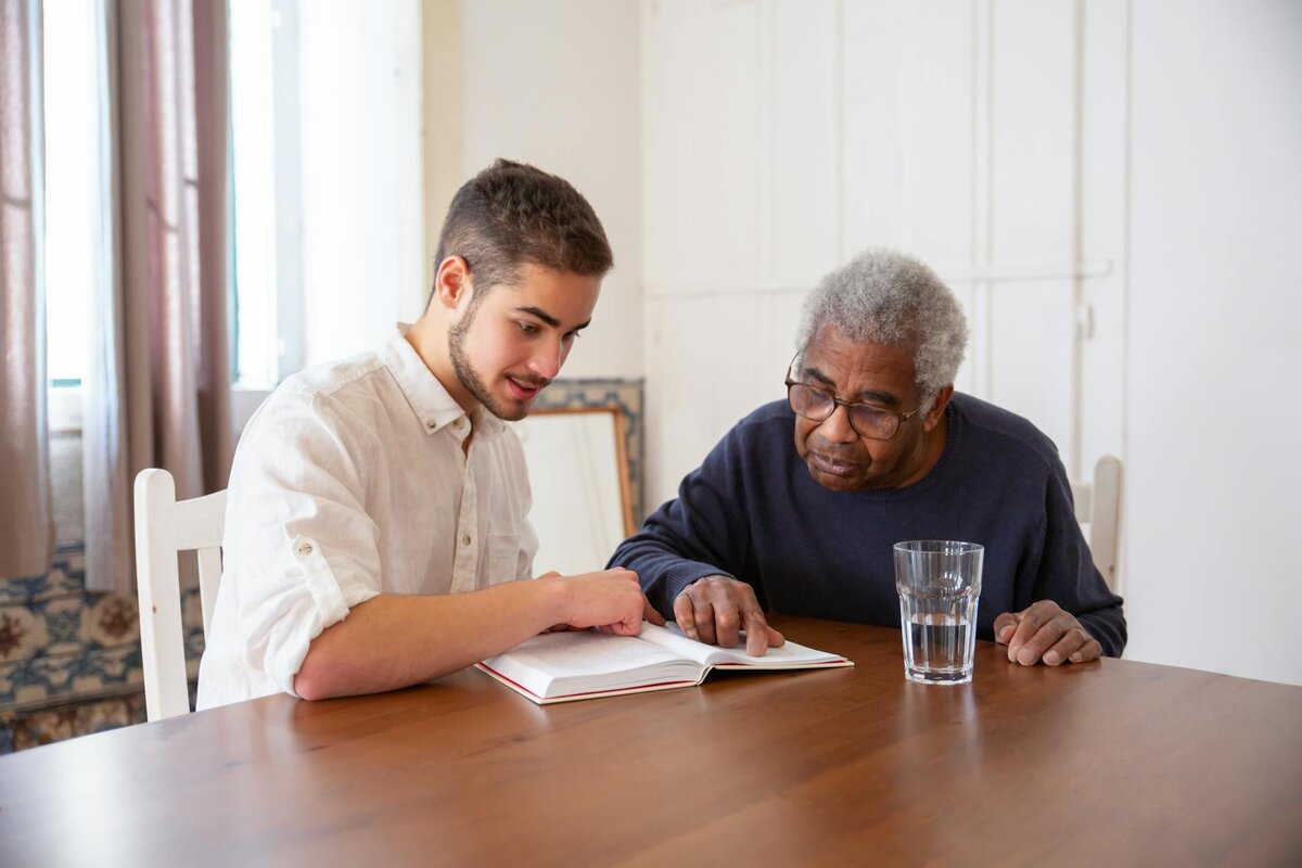 a guy helping an elderly
