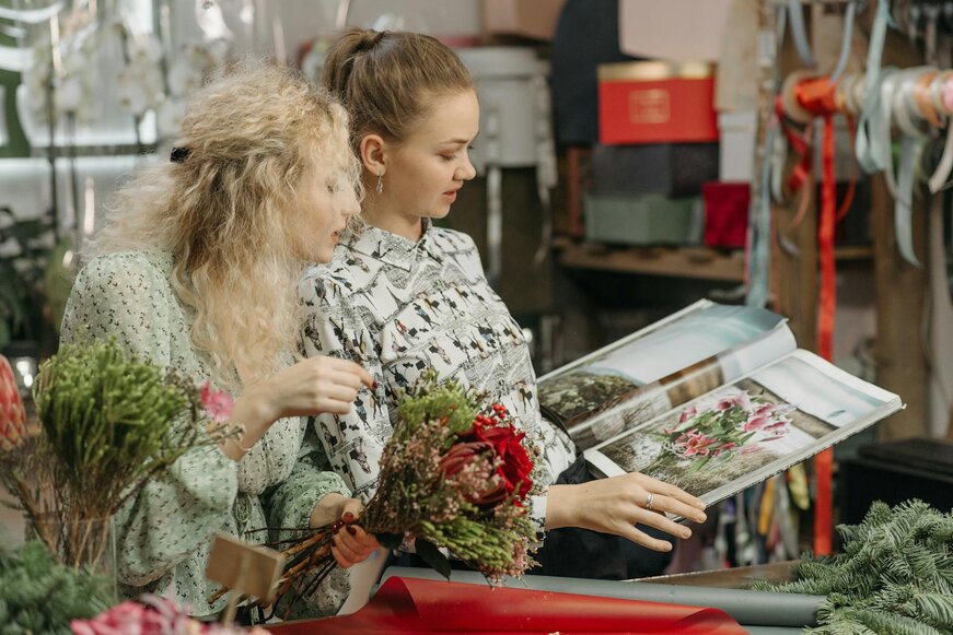 two lady's reading a flower magazine