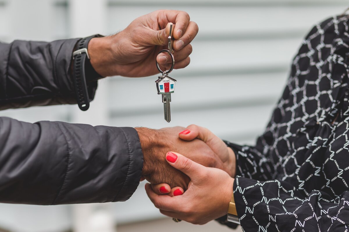  New homeowner receiving house keys after completion