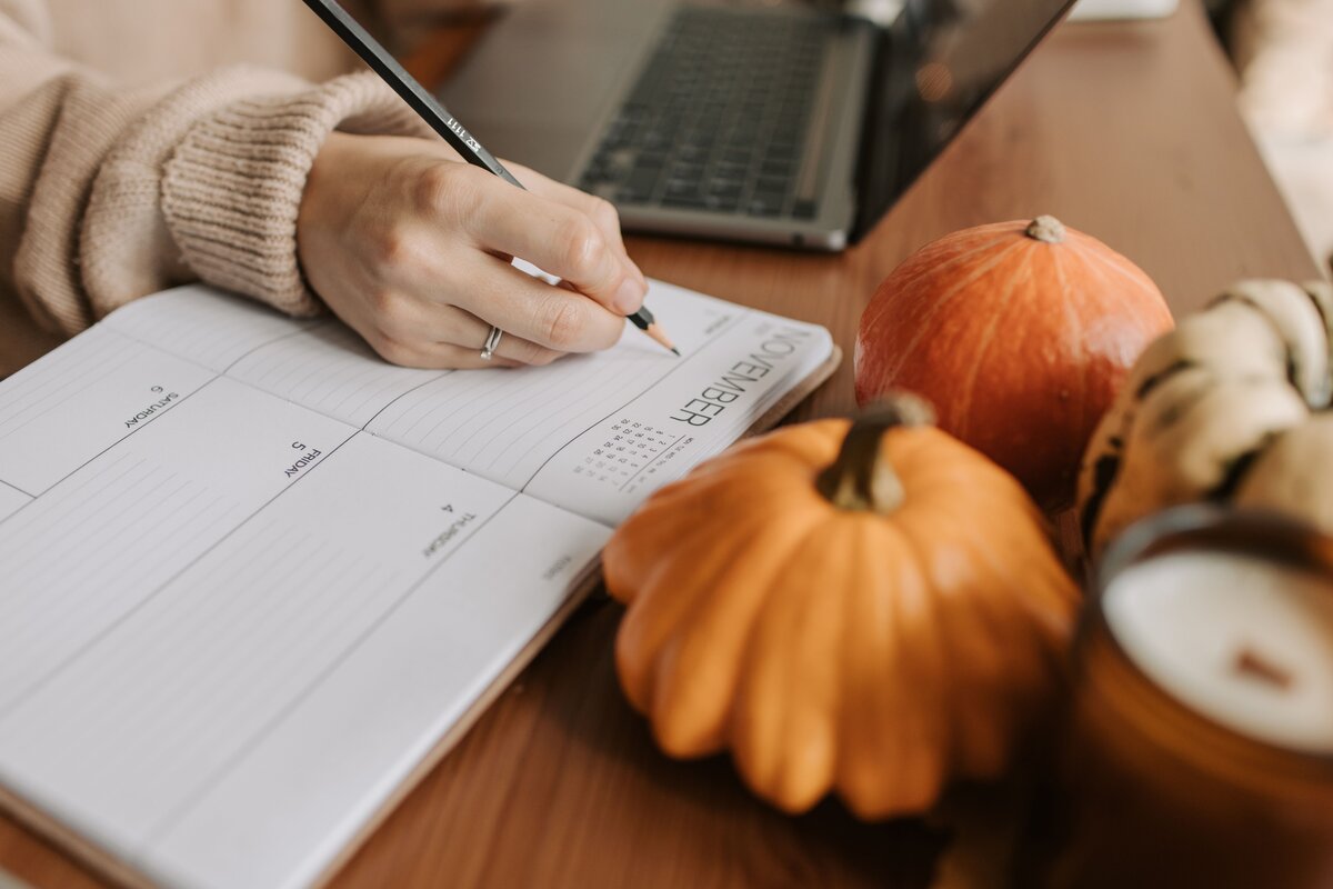 Self-employed woman working at  her desk planner, preparing for making tax digital requirements