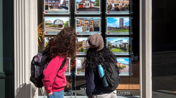 UK house prices fall as rising mortgage rates and global instability affect the property market.