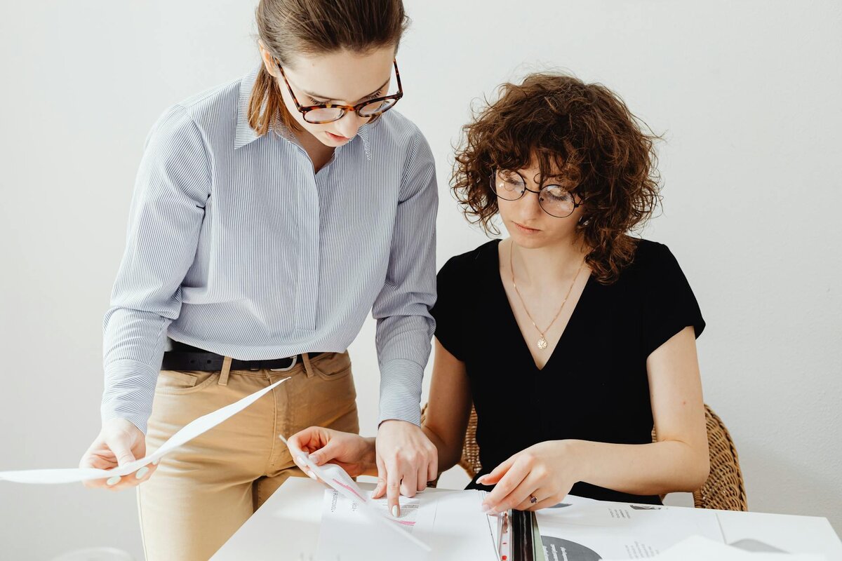 women reviewing paper 
