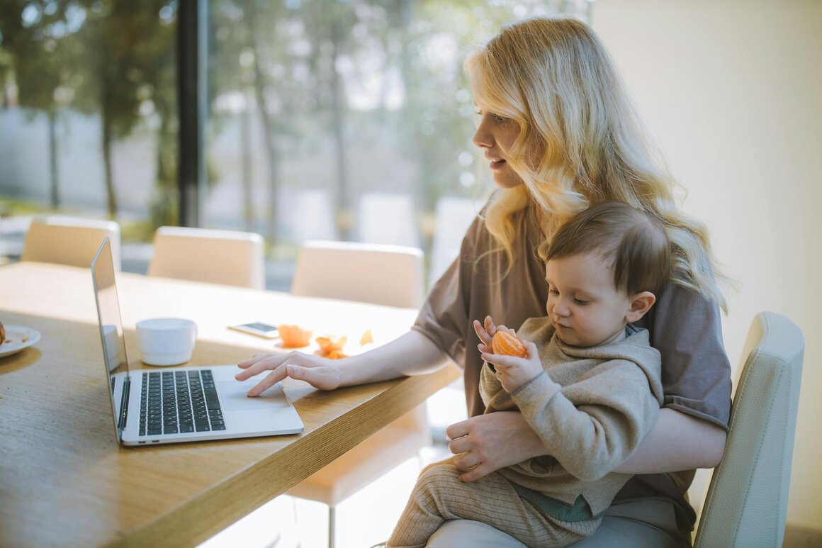mother and son at home on a laptop 