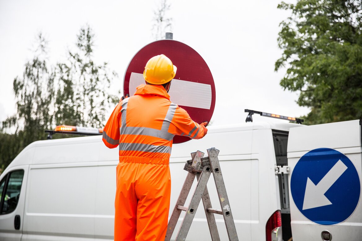 An employee working with the company's utility vehicle