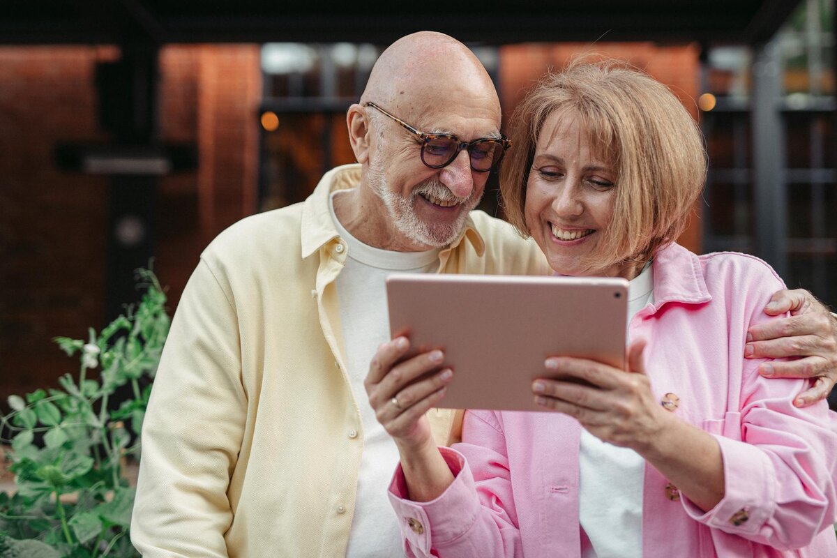 couple looking at tablet