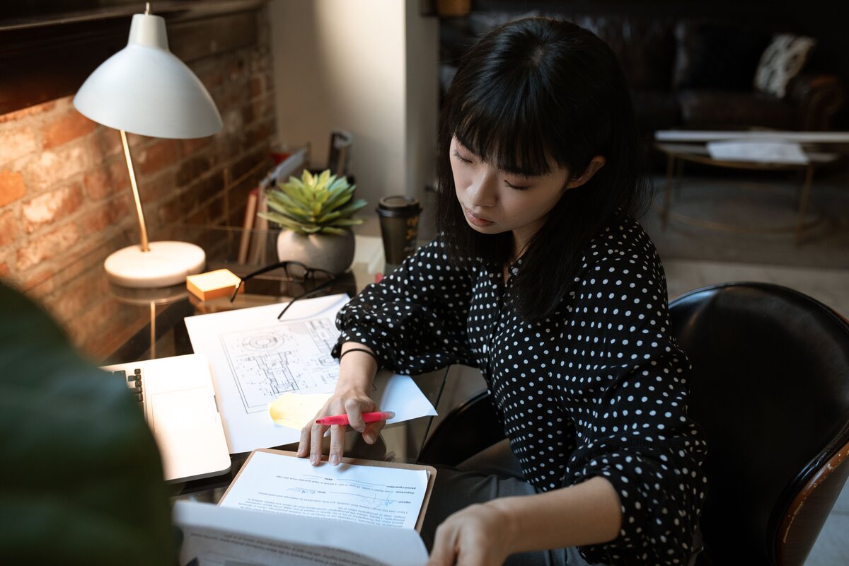 Woman using digital tax software for HMRC compliance.