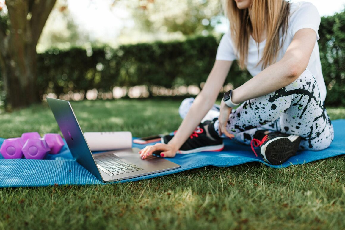 lady on laptop in park