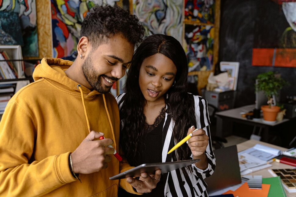 two people looking at ipad