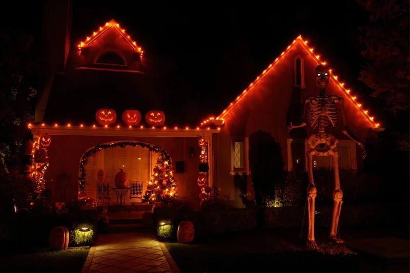 House outlined with colorful holiday lights
