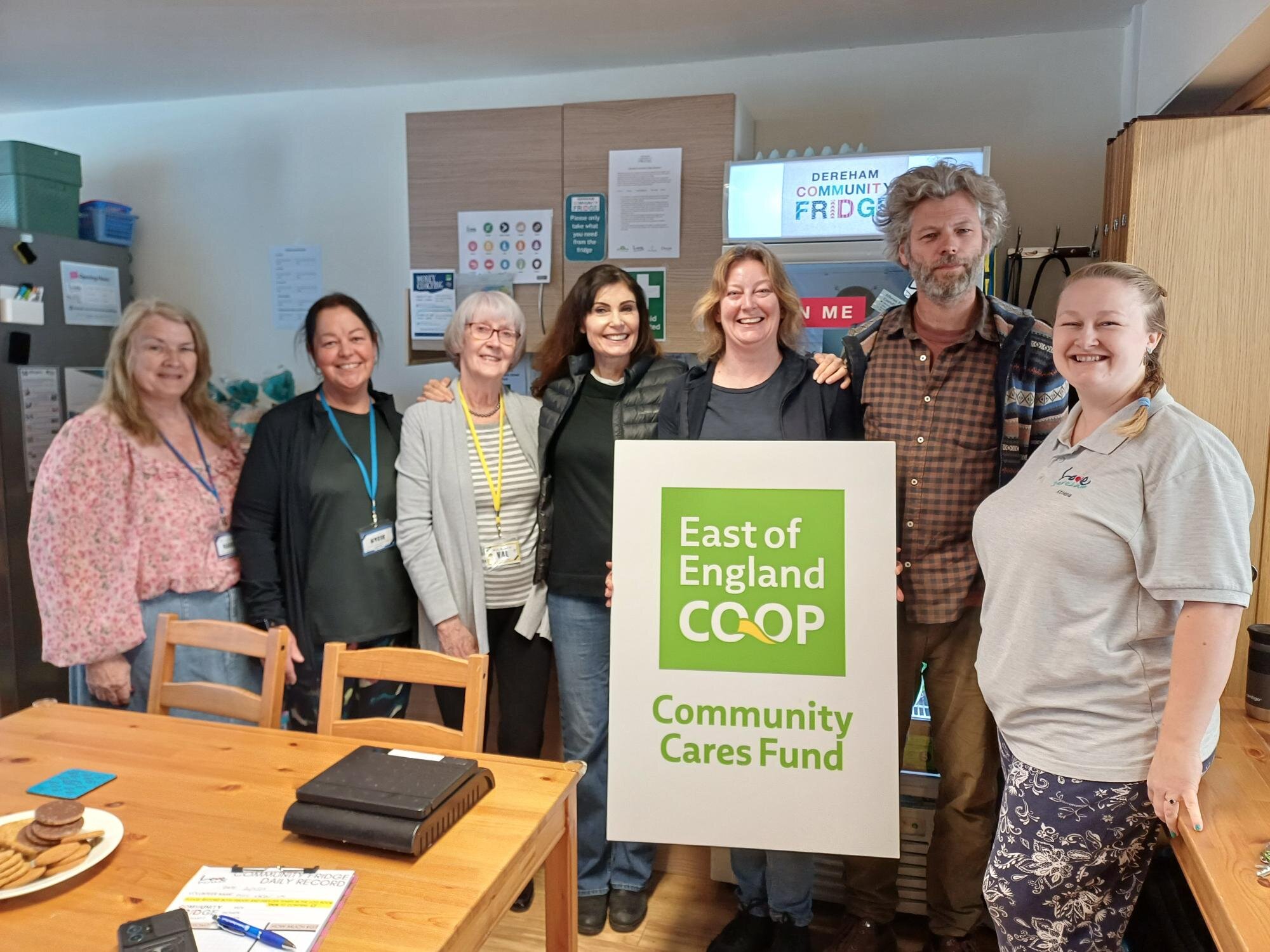 Customer making a £10 East of England Co-op foodbank donation at the checkout using contactless payment.