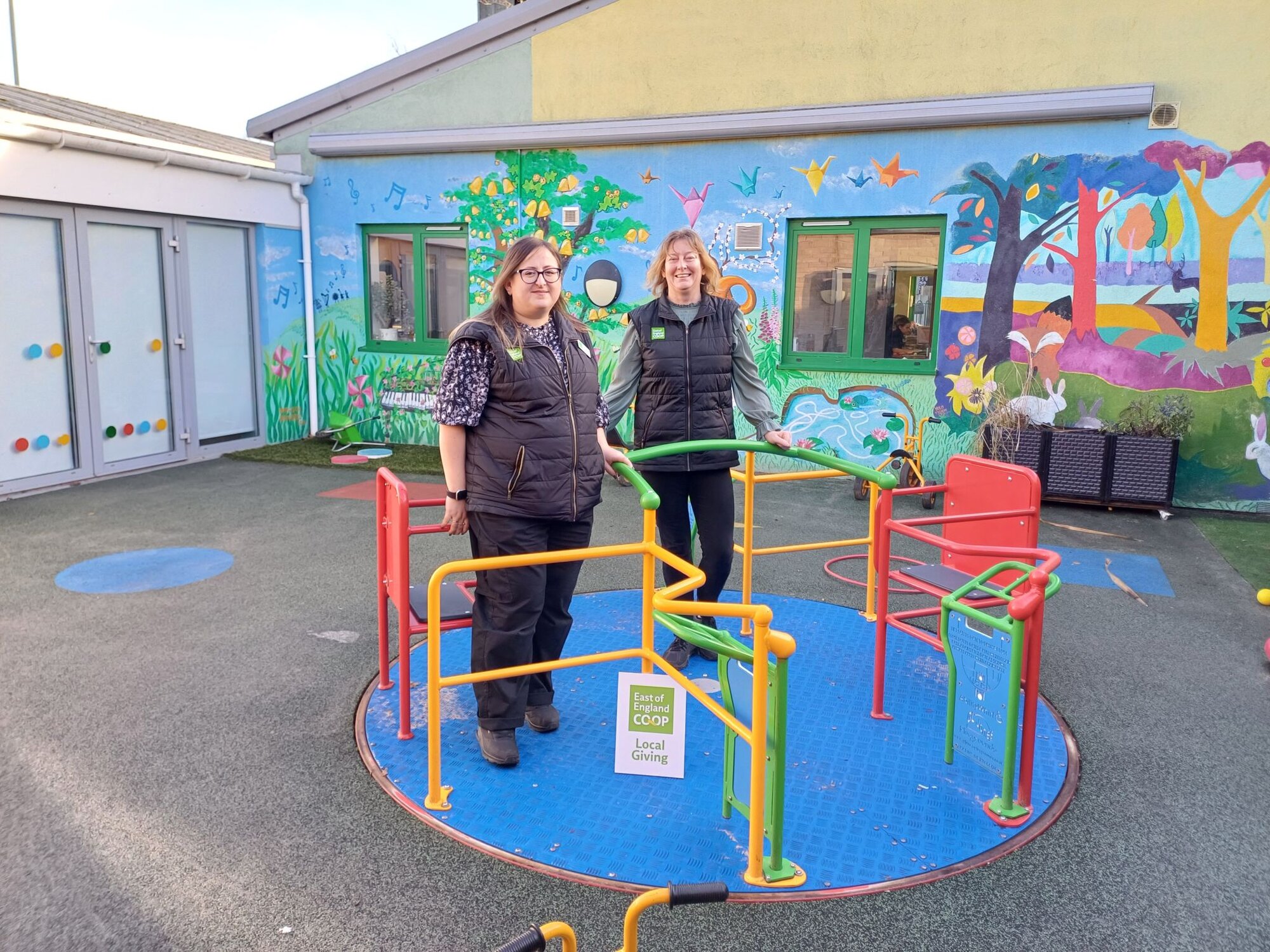 Customer making a £10 East of England Co-op foodbank donation at the checkout using contactless payment.