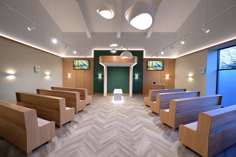 Drayton Road Service Hall chapel with seating for up to 80 guests, modern lighting and digital screens for funeral services.