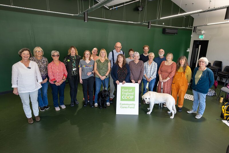 Customer making a £10 East of England Co-op foodbank donation at the checkout using contactless payment.