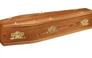 Davenport light oak coffin, affixed with handles in medium oak.