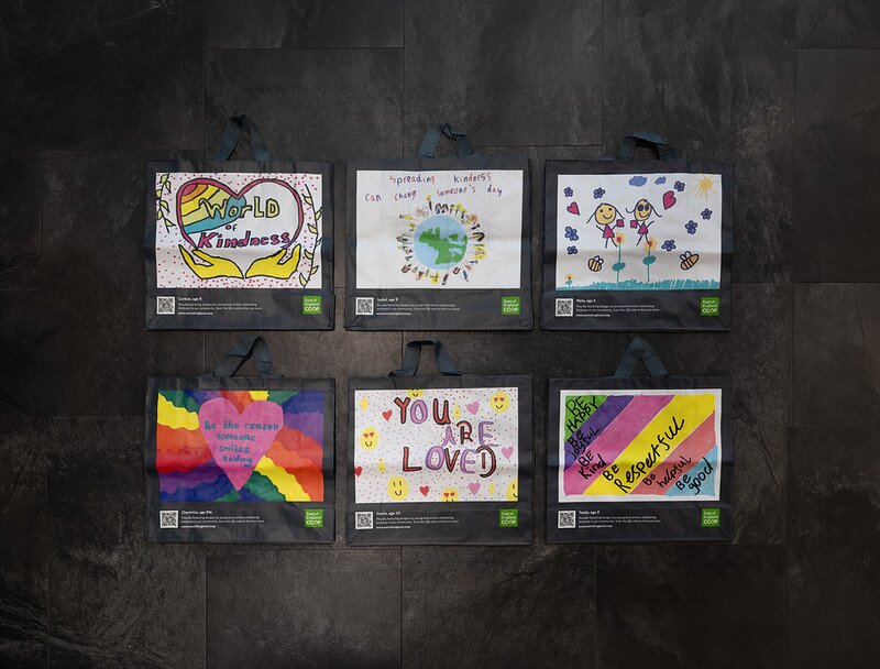 Customer making a £10 East of England Co-op foodbank donation at the checkout using contactless payment.