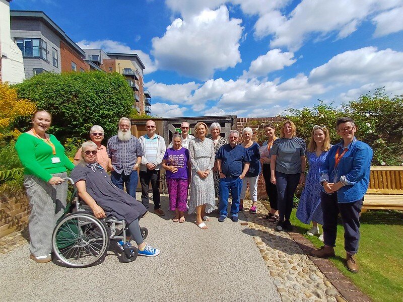 Customer making a £10 East of England Co-op foodbank donation at the checkout using contactless payment.