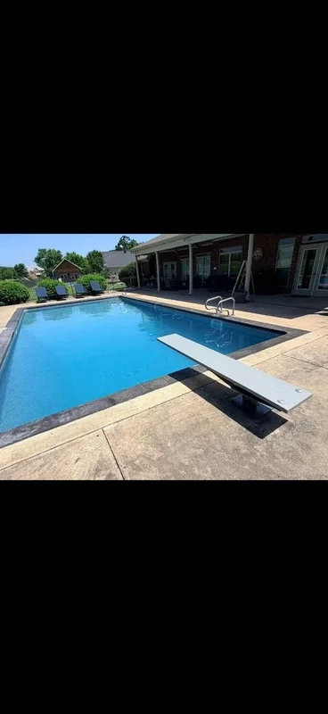 Completed backyard pool with finished decking