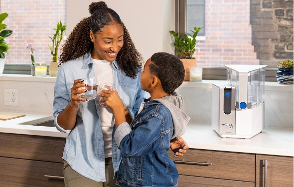 mom and son share clean, AquaTru water