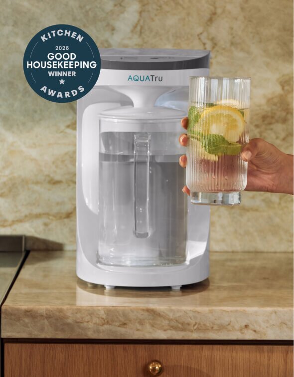 Lady using AquaTru pitcher