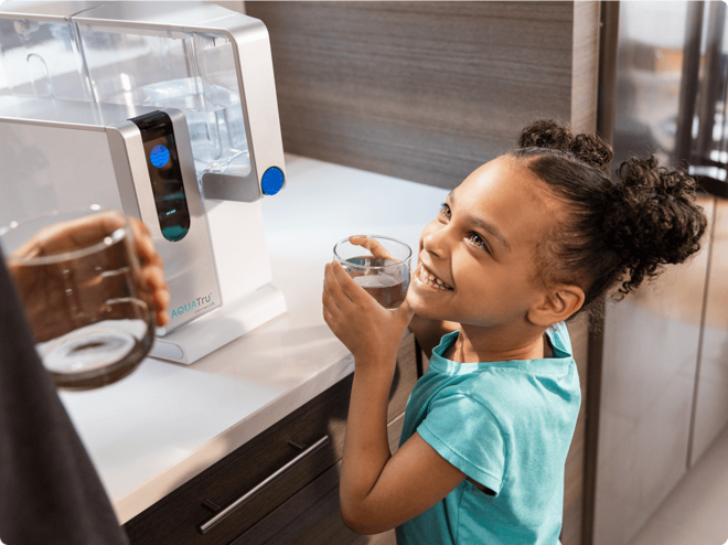 Child enjoying water with Countertop unit