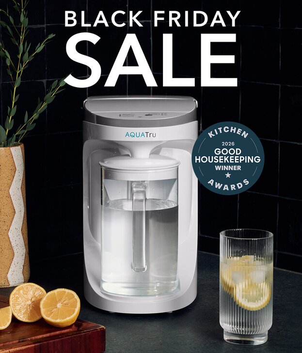 Lady using AquaTru pitcher