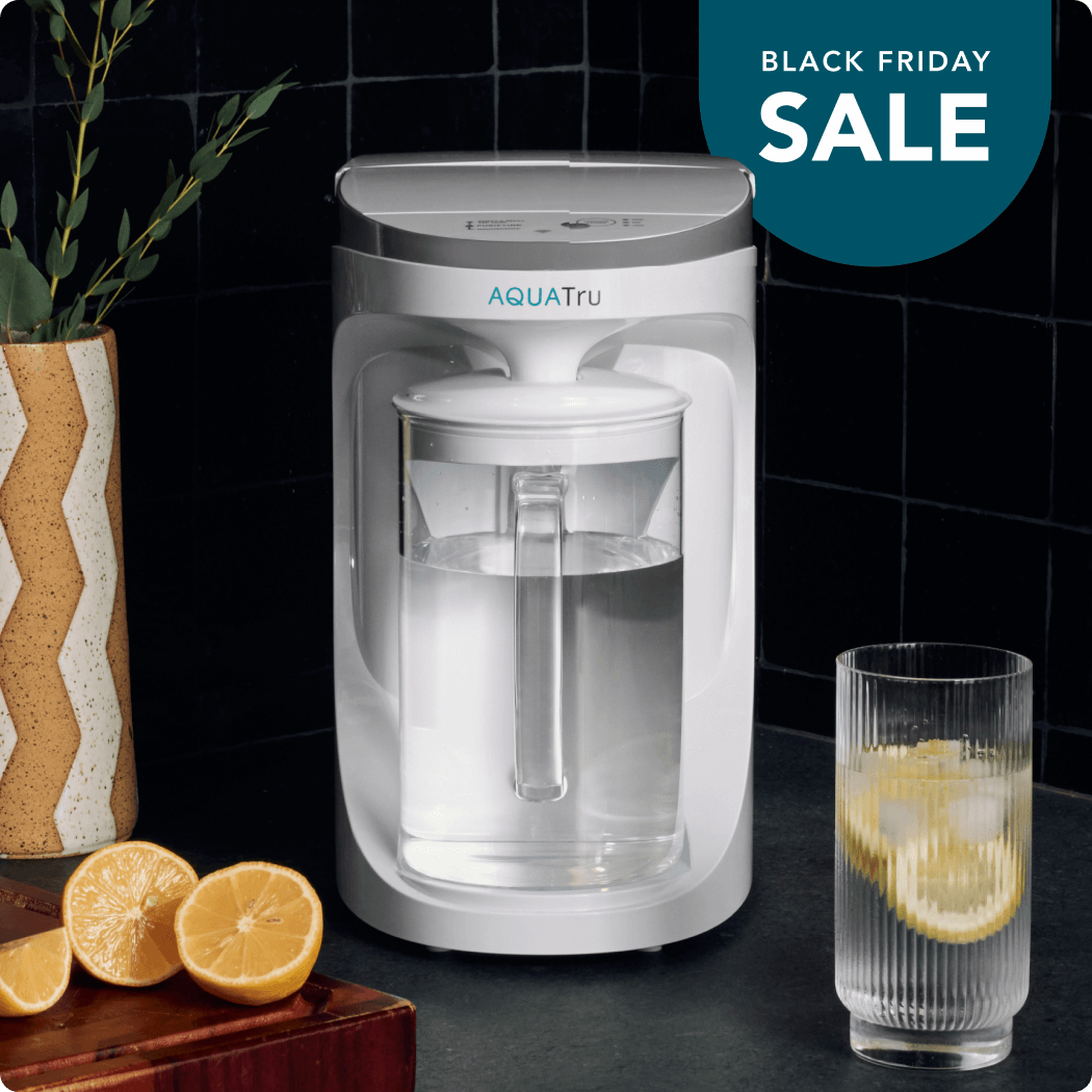 Lady using AquaTru pitcher