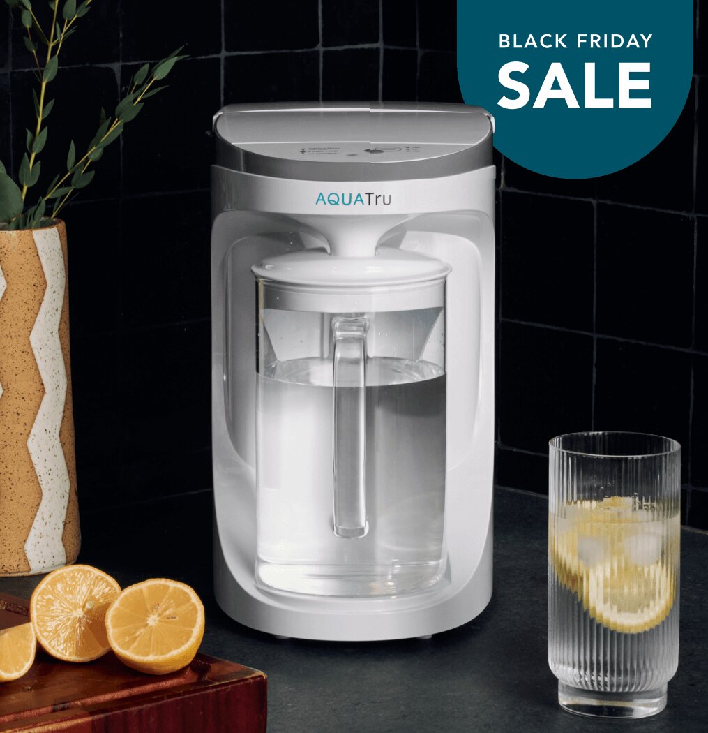 Lady using AquaTru pitcher