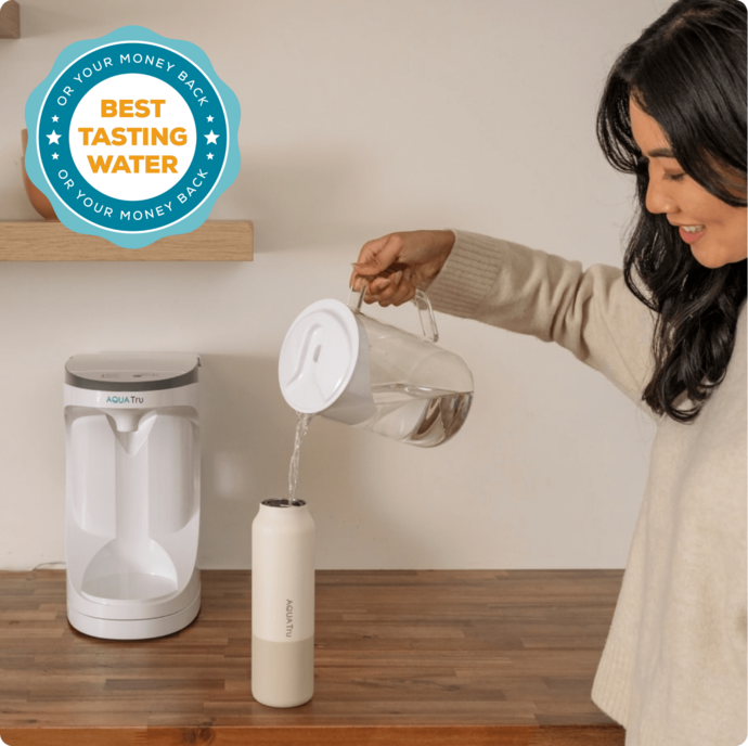 Lady using AquaTru pitcher