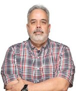 Photo of Fabio Auffant, in a gray and red striped shirt overlooking a white silhouette
