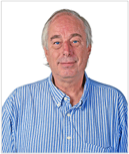 Photo of Ray Martin, in a light blue shirt overlooking a white silhouette